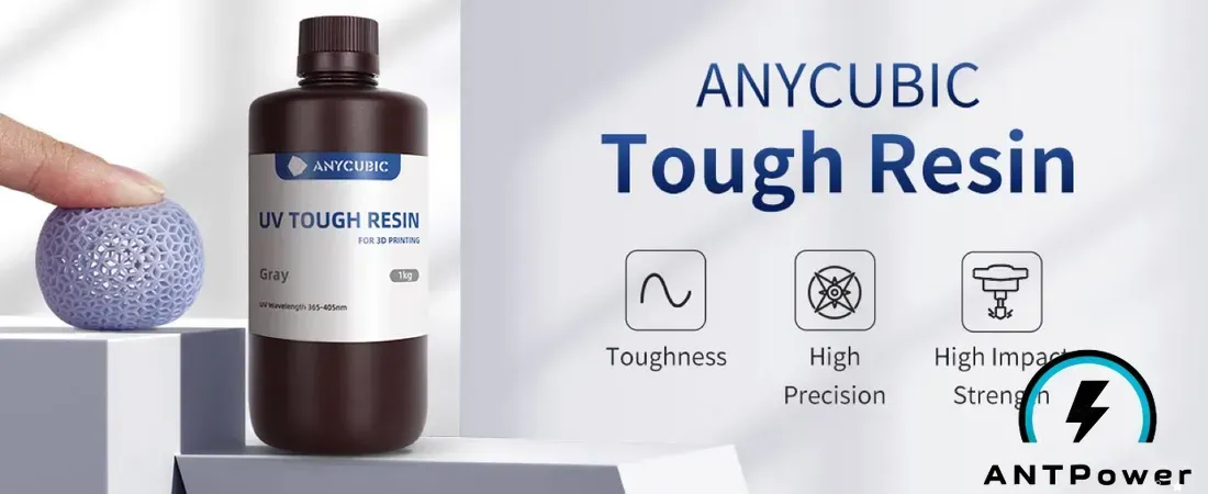 Промо-материал Anycubic: флакон UV Tough Resin серого цвета и напечатанный ажурный мяч, который прижимают пальцем